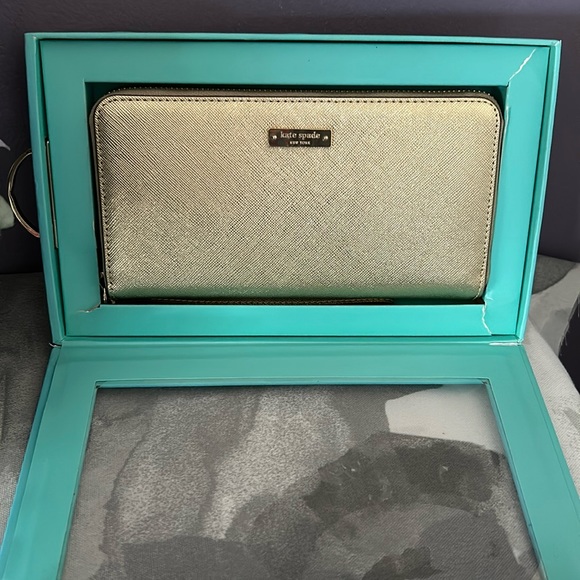 kate spade Handbags - Kate Spade Gold Saffiano Leather Zip Around Wristlet Wallet Storybook Lining NIB
